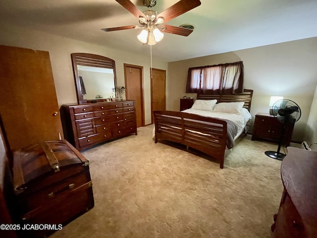 501 W Morgan St, Tipton, MO 65081 - bedroom featuring light carpet and a ceiling fan