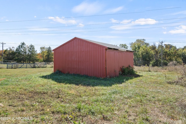 view of outbuilding featuring a yard