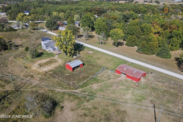 birds eye view of property featuring a rural view