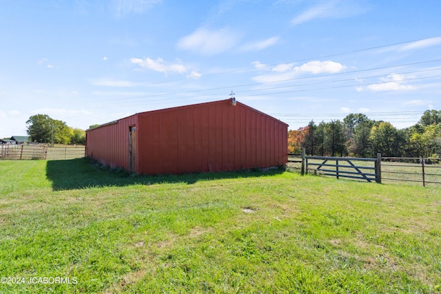 view of outbuilding with a lawn