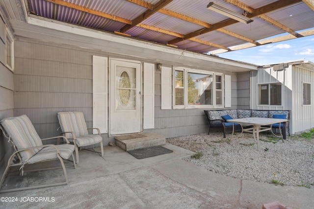 entrance to property with a patio area