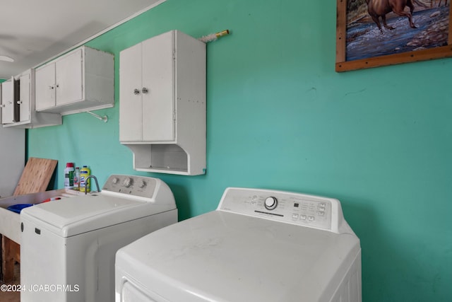 laundry area featuring cabinets, ceiling fan, and washer and dryer