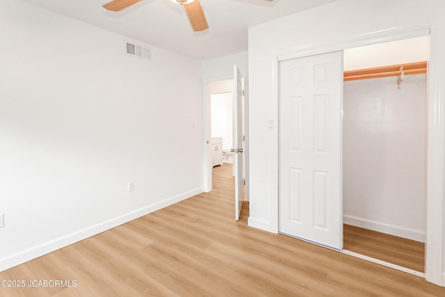 1214 Lynn St, Fulton, MO 65251 - unfurnished bedroom featuring light wood-style flooring, a closet, and a ceiling fan