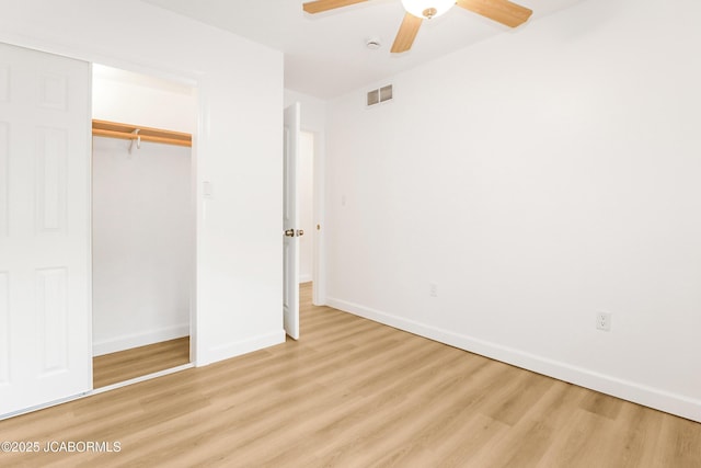 1214 Lynn St, Fulton, MO 65251 - unfurnished bedroom with light wood-type flooring, a closet, and a ceiling fan