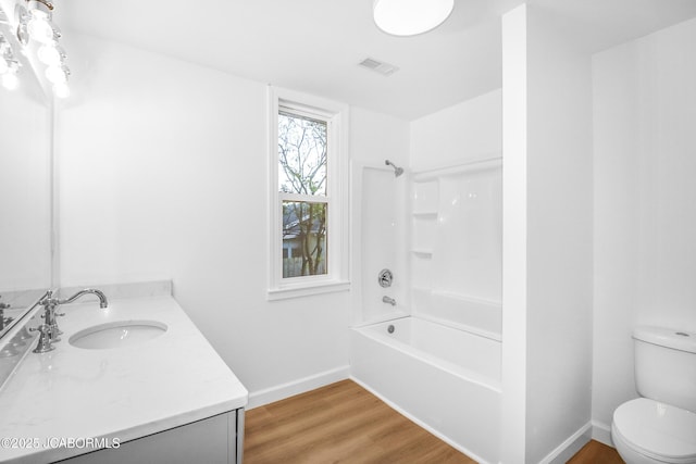 1214 Lynn St, Fulton, MO 65251 - full bath with vanity, wood finished floors, and bathing tub / shower combination