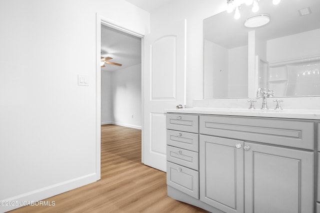 1214 Lynn St, Fulton, MO 65251 - full bath featuring vanity, wood finished floors, and ceiling fan