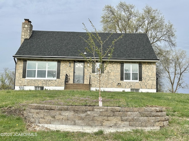 1434 Sunset Lake Rd, Jefferson City, MO 65109 - view of front of house featuring stone siding, a chimney, a shingled roof, and a front lawn