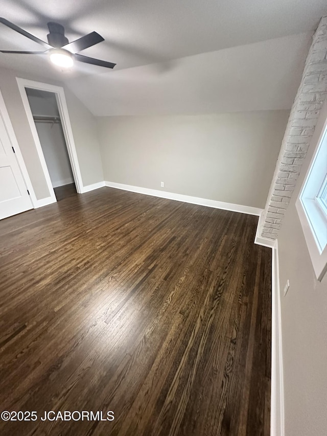 1434 Sunset Lake Rd, Jefferson City, MO 65109 - additional living space featuring dark wood-style floors, vaulted ceiling, ceiling fan, and baseboards
