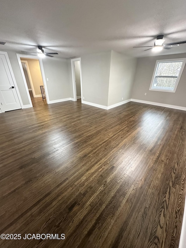 1434 Sunset Lake Rd, Jefferson City, MO 65109 - unfurnished room featuring baseboards, a ceiling fan, and dark wood finished floors