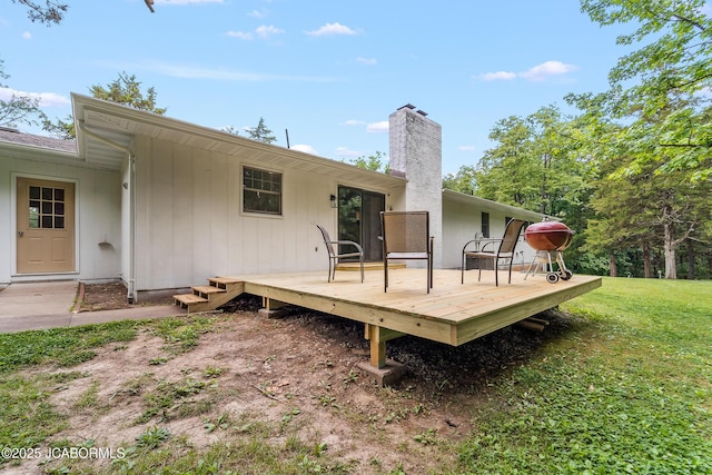 4300 W E Ridge Rd, Columbia, MO 65202 - back of property featuring a chimney, a wooden deck, and a lawn
