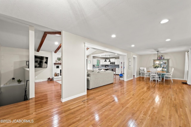 4300 W E Ridge Rd, Columbia, MO 65202 - living room featuring light wood-type flooring, baseboards, and recessed lighting