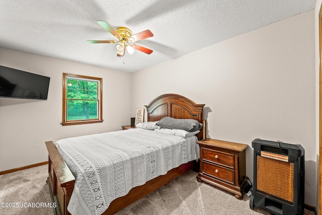 4300 W E Ridge Rd, Columbia, MO 65202 - carpeted bedroom with baseboards, a ceiling fan, and a textured ceiling