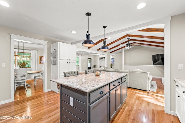4300 W E Ridge Rd, Columbia, MO 65202 - kitchen featuring a center island, light wood-type flooring, recessed lighting, a ceiling fan, and open floor plan