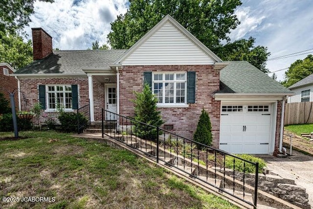 view of front of property with a garage and a front yard