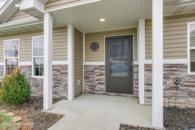 property entrance featuring covered porch