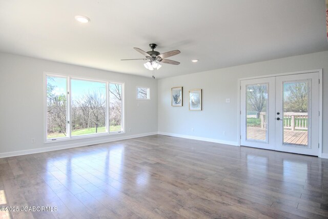 12271 County Road 4037, Holts Summit, MO 65043 - unfurnished living room featuring french doors, wood finished floors, baseboards, ceiling fan, and recessed lighting