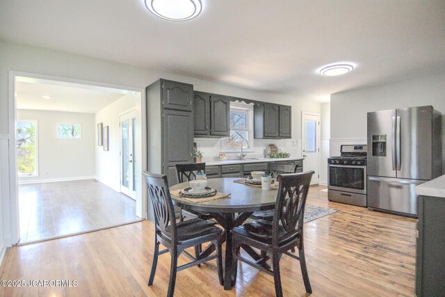 12271 County Road 4037, Holts Summit, MO 65043 - dining room with light wood finished floors and baseboards