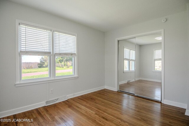 12271 County Road 4037, Holts Summit, MO 65043 - empty room with hardwood / wood-style flooring and baseboards
