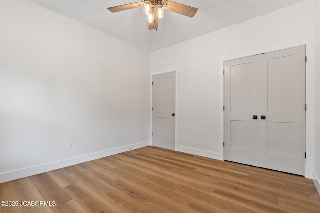 7058 County Road 409, Fulton, MO 65251 - unfurnished bedroom with light wood-type flooring, a closet, and ceiling fan