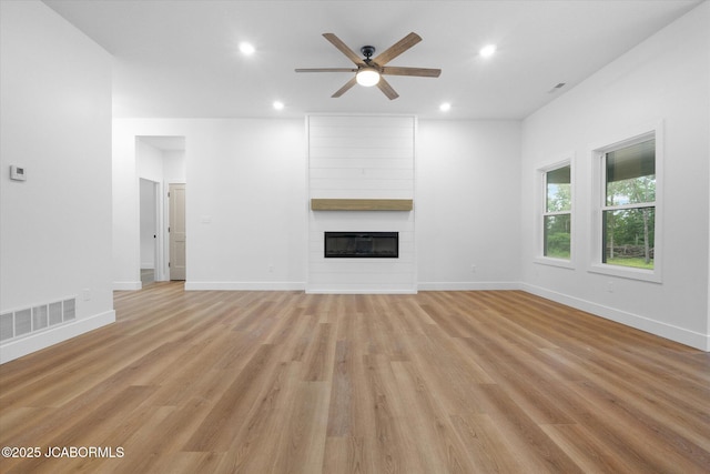 7058 County Road 409, Fulton, MO 65251 - unfurnished living room with a ceiling fan, a fireplace, recessed lighting, and light wood finished floors