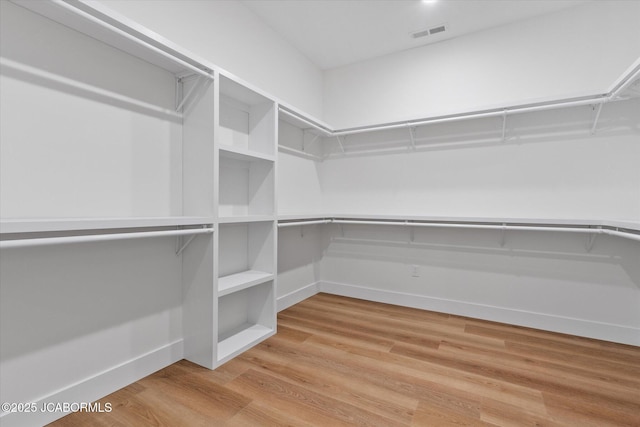 7058 County Road 409, Fulton, MO 65251 - walk in closet with light wood finished floors