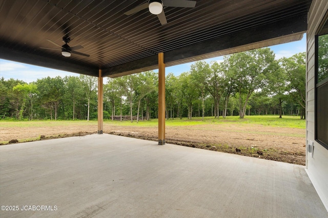 7058 County Road 409, Fulton, MO 65251 - view of patio featuring a ceiling fan and view of scattered trees