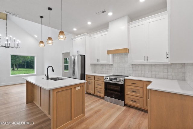 7058 County Road 409, Fulton, MO 65251 - kitchen featuring stainless steel appliances, light wood-style floors, tasteful backsplash, light countertops, and recessed lighting
