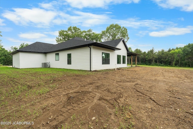 7058 County Road 409, Fulton, MO 65251 - view of property exterior featuring dirt driveway and roof with shingles