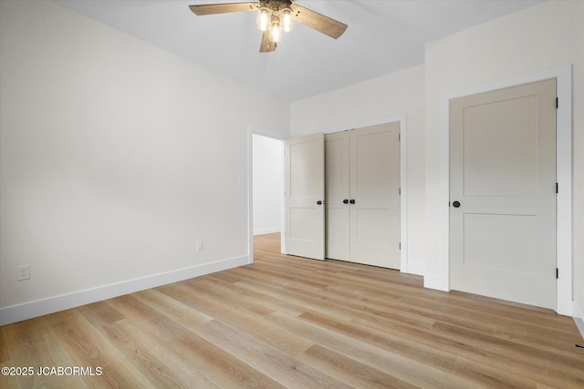 7058 County Road 409, Fulton, MO 65251 - unfurnished bedroom with light wood-style floors, a closet, and ceiling fan