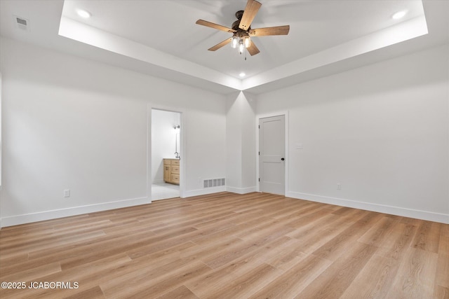 7058 County Road 409, Fulton, MO 65251 - spare room featuring a ceiling fan, a raised ceiling, recessed lighting, and light wood finished floors
