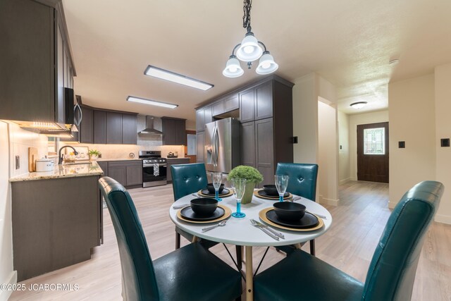 232 Pheasant Ln, Holts Summit, MO 65043 - dining space with light wood-style floors and baseboards