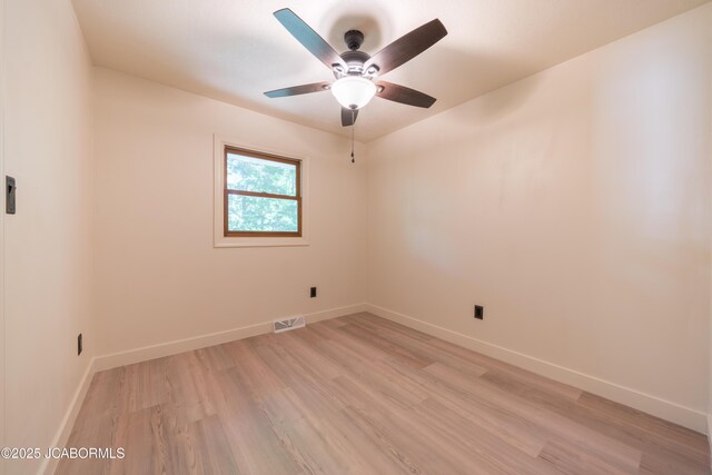 232 Pheasant Ln, Holts Summit, MO 65043 - empty room with light wood-style flooring and ceiling fan