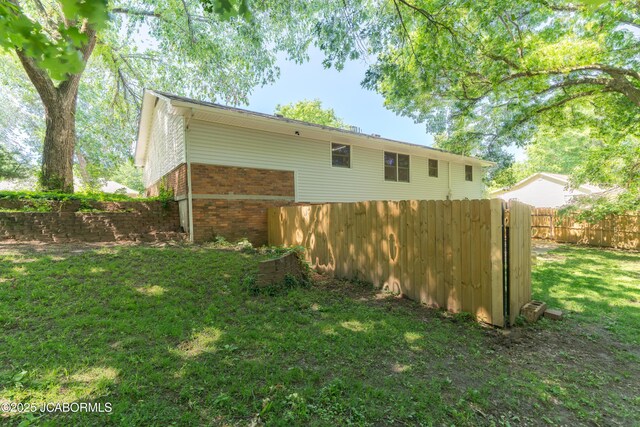 232 Pheasant Ln, Holts Summit, MO 65043 - back of property featuring brick siding