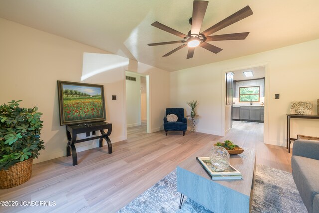 232 Pheasant Ln, Holts Summit, MO 65043 - living room featuring a ceiling fan and light wood-type flooring