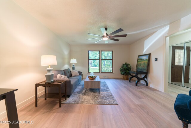 232 Pheasant Ln, Holts Summit, MO 65043 - living area with a ceiling fan and light wood-type flooring
