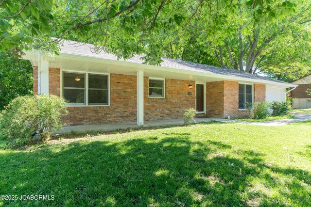 232 Pheasant Ln, Holts Summit, MO 65043 - ranch-style home featuring brick siding, a front yard, a garage, and roof with shingles