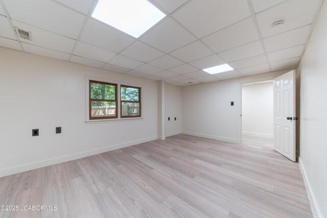 232 Pheasant Ln, Holts Summit, MO 65043 - spare room with a drop ceiling, light wood finished floors, and a smoke detector