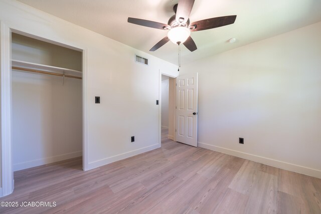 232 Pheasant Ln, Holts Summit, MO 65043 - unfurnished bedroom featuring light wood finished floors, a closet, and a ceiling fan