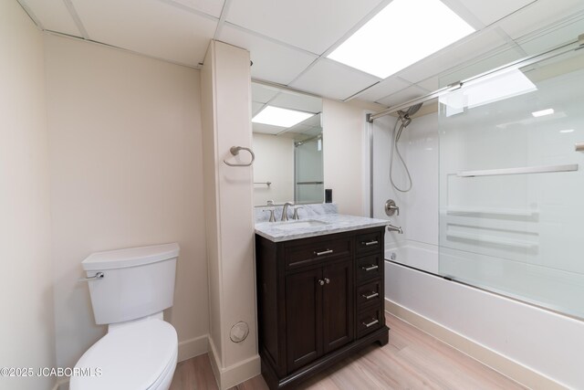 232 Pheasant Ln, Holts Summit, MO 65043 - full bathroom featuring vanity, wood finished floors, enclosed tub / shower combo, and a drop ceiling