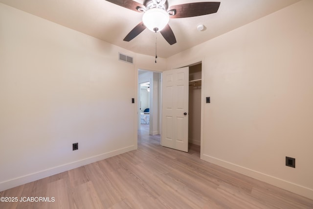 232 Pheasant Ln, Holts Summit, MO 65043 - unfurnished bedroom with light wood-type flooring, a closet, and a ceiling fan