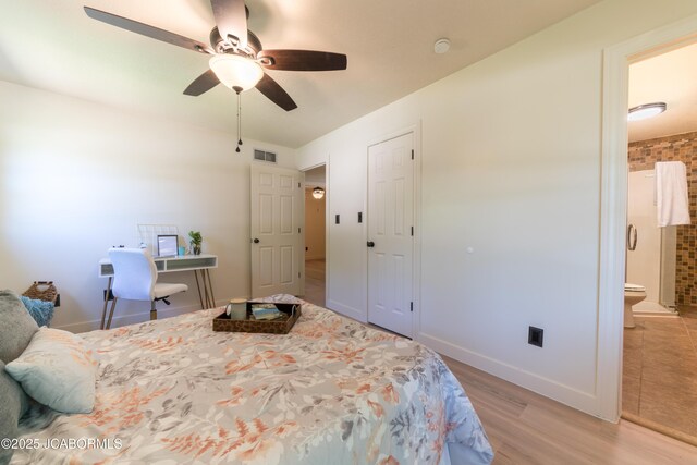 232 Pheasant Ln, Holts Summit, MO 65043 - bedroom featuring light wood-style flooring, ensuite bath, and ceiling fan