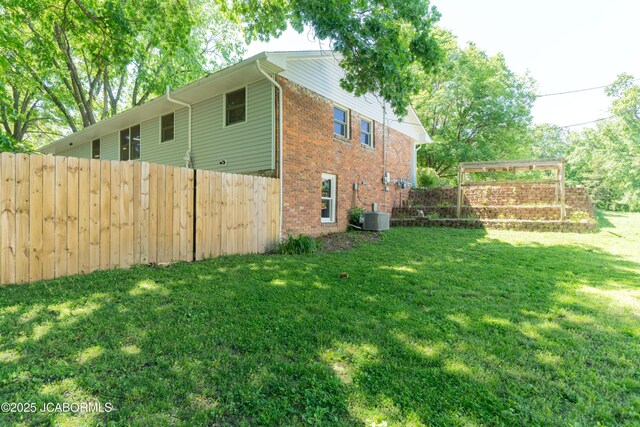 232 Pheasant Ln, Holts Summit, MO 65043 - view of side of home with brick siding and a central air condition unit