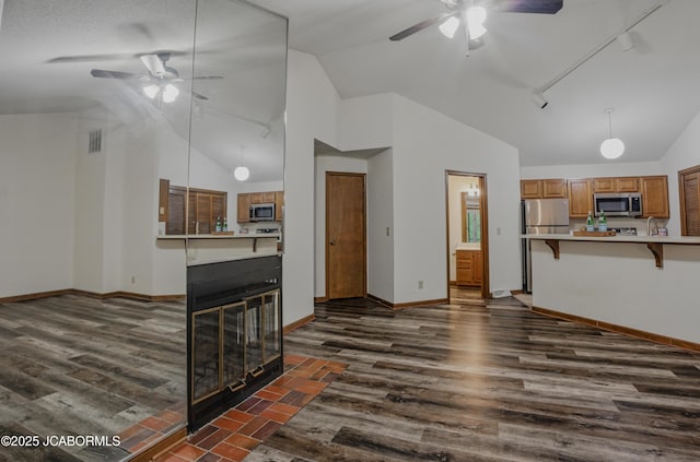 808 Park De Ville Pl, Columbia, MO 65203 - unfurnished living room with ceiling fan, dark wood-style floors, and high vaulted ceiling