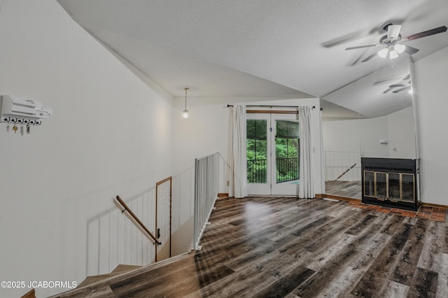 808 Park De Ville Pl, Columbia, MO 65203 - unfurnished living room featuring wood finished floors, ceiling fan, a fireplace with flush hearth, and lofted ceiling