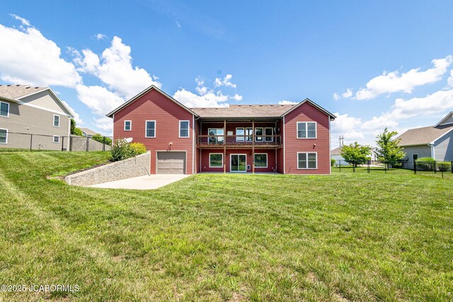 1220 Markway Mills Ct, Jefferson City, MO 65101 - rear view of house featuring an attached garage, concrete driveway, and a balcony