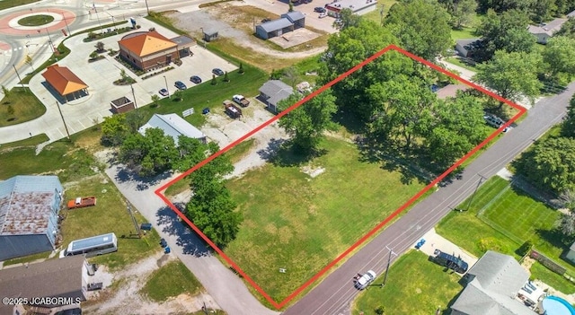 aerial view of property and surrounding area with property parcel outlined