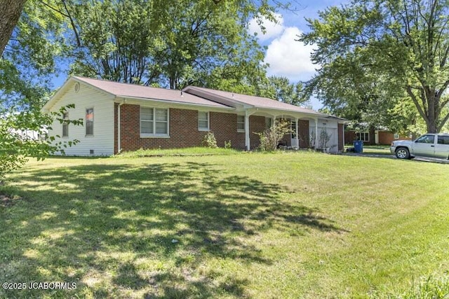 ranch-style house featuring a front yard and brick siding