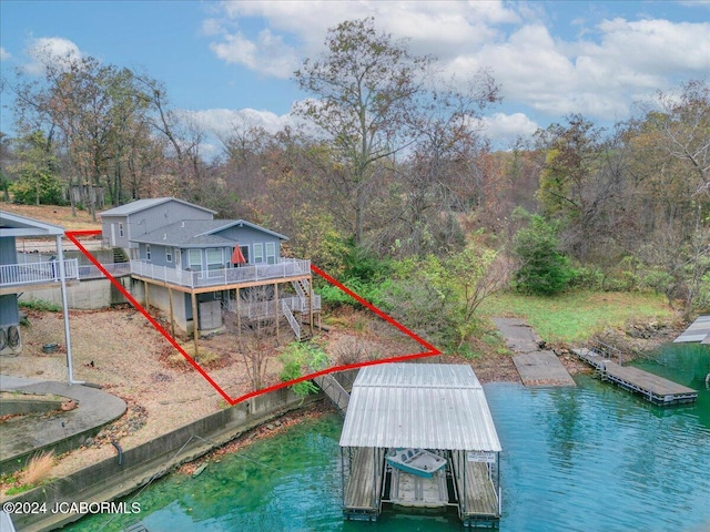 exterior space with a water view and boat lift