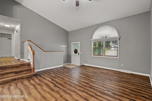foyer featuring high vaulted ceiling, ceiling fan, wood finished floors, and visible vents