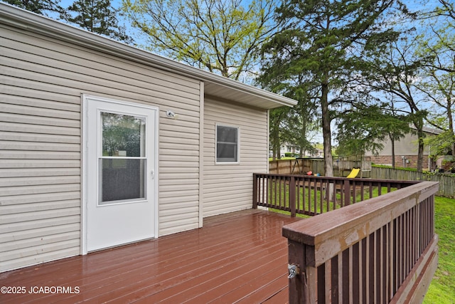 deck featuring a fenced backyard and a yard